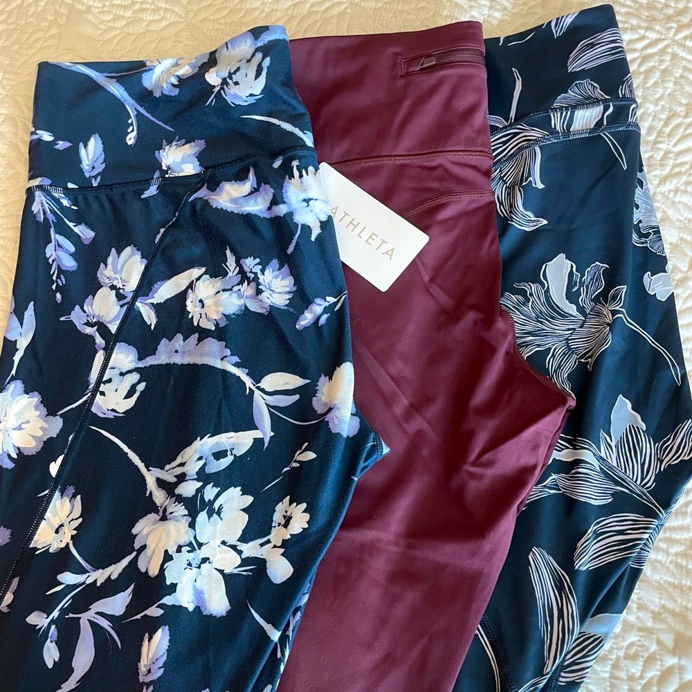 Athleta leggings lot of 3 including NWT lightning tights, and 2 blue floral GUC!